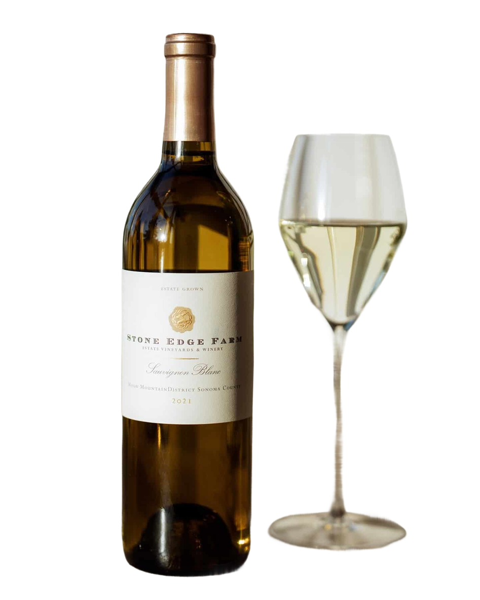 A crisp glass of white wine resting on a stone ledge